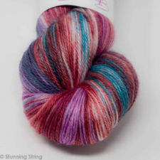Variegated yarn in aqua, orchid, red, true blue and more.