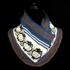 Mosaic cowl has pattern like Greek keys at top and bottom, with a row of forward-facing sheep in the middle.