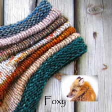 Stockinette striped cowl with garter edges.