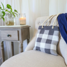 Flat tote with grommets for rope handles. Color blocks resemble woven gingham fabric.