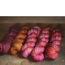 Bright skeins in pinks and golds.