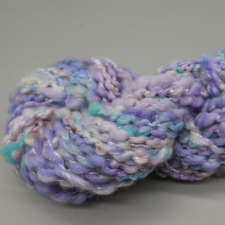 Pale purple handspun with bits of aqua and white.