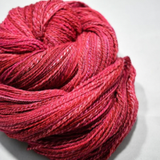 Red handspun with pink highlights and a bit of marling.