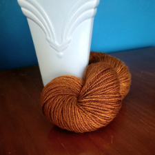 Warm cinnamon brown solid yarn on a BFL base.