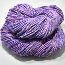 Reddish purple yarn with periwinkle highlights and some marling.