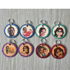 Eight round wood stitch markers with custom image of photos or avatars, backed with glitter vinyl border.