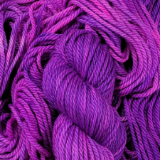 Red violet and fuchsia variegated yarn on a bulky base.