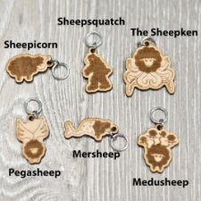 Six stitch markers of sheep as The Kraken, Sasquatch, a unicorn, Pegasus, a mermaid and Medusa.