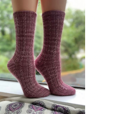 Toe-up socks with short-row heels. Pattern is a rib that alternates with a small cable that has a bead in each pair of twists.