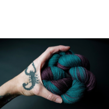 Variegated yarn in deep teal and red wine.
