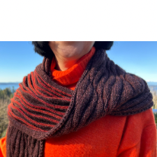 Scarf has waved texture, including a second color on the front to bring out the design.