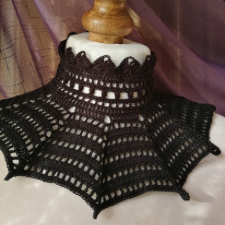 high crocheted color ends in zigzag at top. Wider bottom of the collar is batwing inspired.