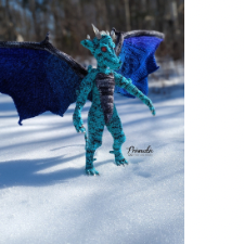 Dragonkin is 19 inches or 48 centimeters tall by 36 inches or 91 centimeters wide. It has broad wings, stands upright like a person, and has a scary, skull-like face with ears, horns and spikes.