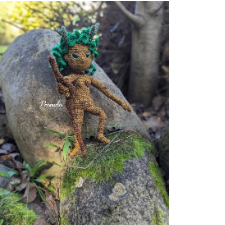 Earth sprite is 12 inches or 34 centimeters tall. It has an earth-brown body with small breasts, green, leafy hair, and tiny antlers.