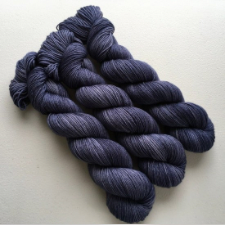 Tonal deep purple-gray hanks.