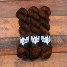 Warm brown tonal yarn with black lowlights.