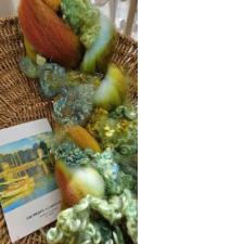 Small image of Bridge at Argenteuil and matching fiber in American Churro, Polwarth and BFL lamb locks. Colors match the artwork and are golds, russet and mint green.