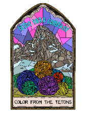 Stained glass window with balls of yarn and the words Color from the Tetons.